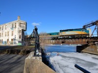 <b>Past out of use tower and ties.</b> VIA 6404 pushes a deadhead movement towards Montreal's Central station. At left is the out of use Wellington tower and towards the bottom left are a few ties that were part of CN's right of way to the Port of Montreal till about 20 years ago.