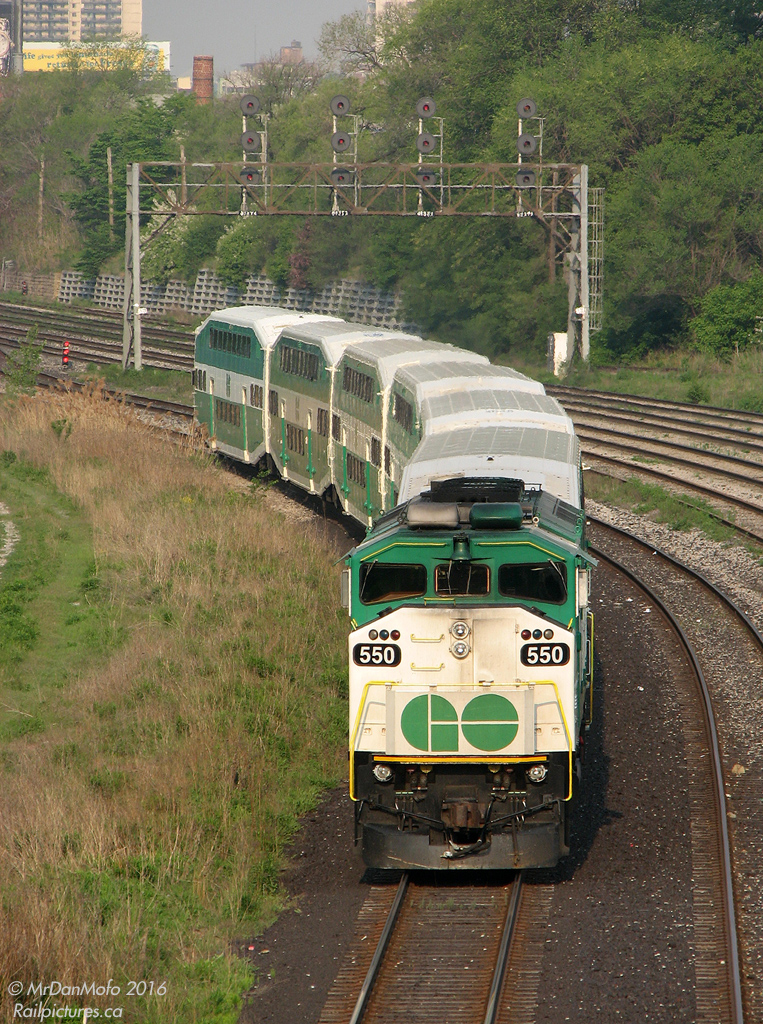 This ain't no L10L, it's a wee L6! Back in 2007, GO was still running shorter L6 consists (locomotive + 6 cars) on the Stouffville, Unionville, Georgetown and Barrie lines. It's pretty much the shortest you can make a GO train these days, as the GO station signage and platforms are all set up to have the 2500-series "5A" accessible car as 5th in a consist (and the cab cars aren't configured to be used as 5A's).

After finishing its morning chores on the Barrie line, train #802's 6-car consist deadheads back to Willowbrook to lay over the day before heading back out in the PM as #868 on the Stouffville line (as per normal equipment cycling practices). Today, GO F59PH 550 is providing the power, with cab car 235 leading on the other end, pausing westbound at Bathurst Street awaiting the light to proceed west on the Oakville Sub.
