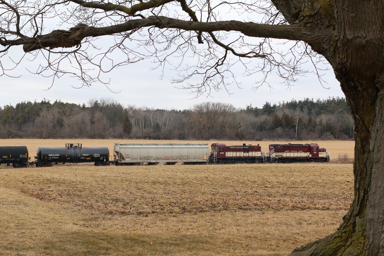 OSR's daily Guelph Jct. RR train to Guelph was running a bit late this day not arriving in Guelph until after noon, with the number of veteran EMD units now on the roster it is always nice to see a solid MLW lash up powering the days train. This dreary, snowless day finds the days train passing an old dormant tree and farmland north of Arkel as the train is just a few miles south of its destination of Guelph.