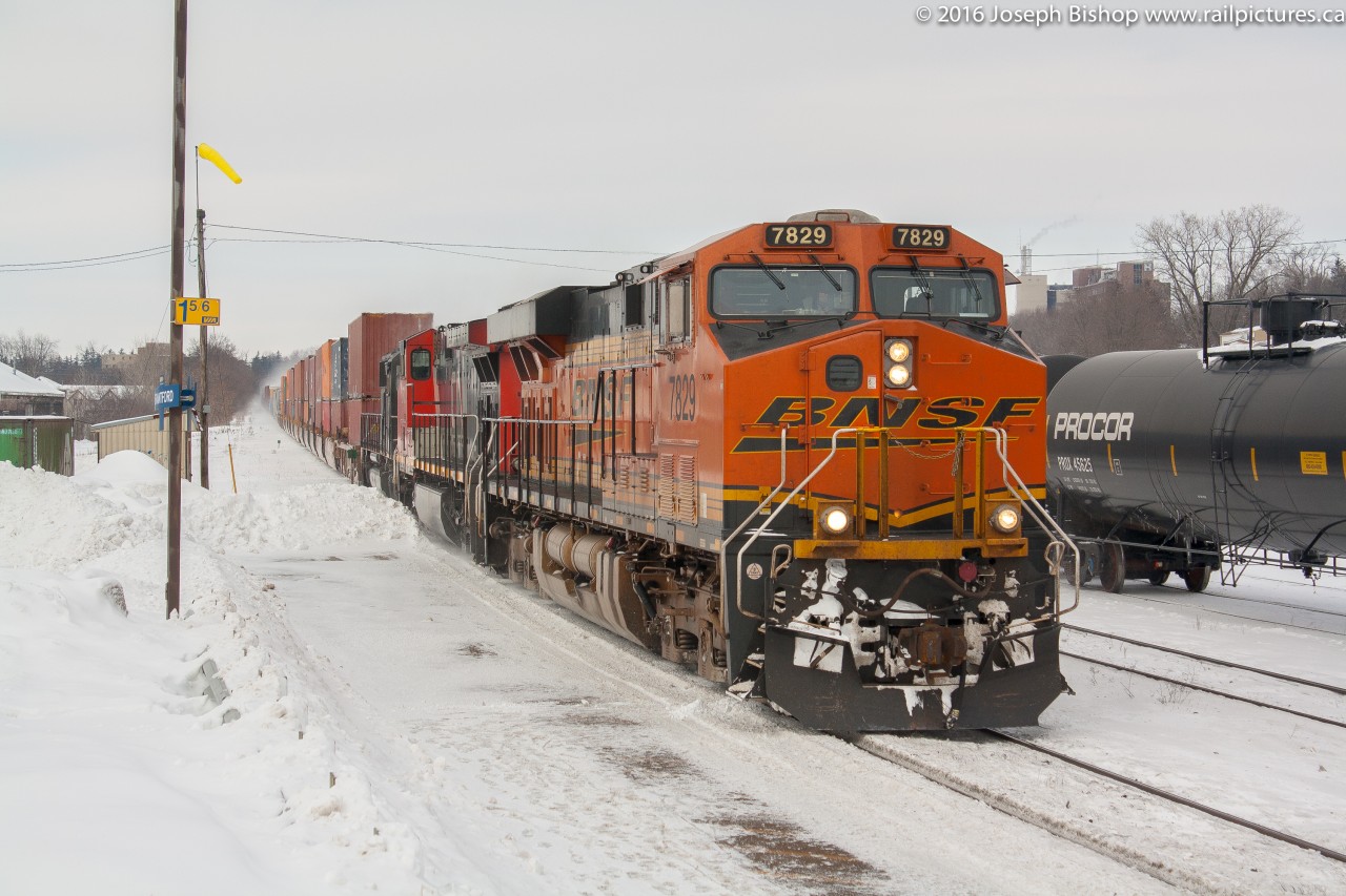 CN 396 makes a late daylight appearance in Brantford with BNSF 7829 leading a pair of IC units on a snowy February 2014 morning.  I believe snow storms the day before had made more missed connections which explains the cut of intermodal on the head end of 396 on this day.  Back in 2014 Foreign Power or FPON as we like to call it was plentiful on CN and it was not uncommon to get a foreign leader up here at the time...man I miss those days.