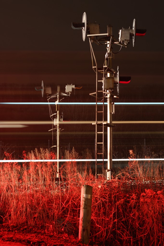 The crossing at Tramaine Rd and the Galt sub. is living on borrowed time as a new road is being constructed with a bridge further east. I've taken many shots here in the day but never at night. I was hoping for a bit of fog this night but it was not meant to be. Here we see a westbound CP freight storming past the double sided signals at mile 34, the train is quickly loosing speed as it digs into the Niagara Escarpment. The warm red glow of the crossing signals illuminates the area, inside the crew are most likely getting their clearance out of Guelph Jct. only a few miles ahead.