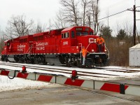 After arriving empty handed and switching tracks, CP's daily 'pick up" run today finds CP 2250 and CP 2325 (GP20C-ECO), waiting for the crossing gates to fully deploy, so it can cross the 1st Line and switch tracks once again to enter Guelph Junction and pick up its return load and head back east.