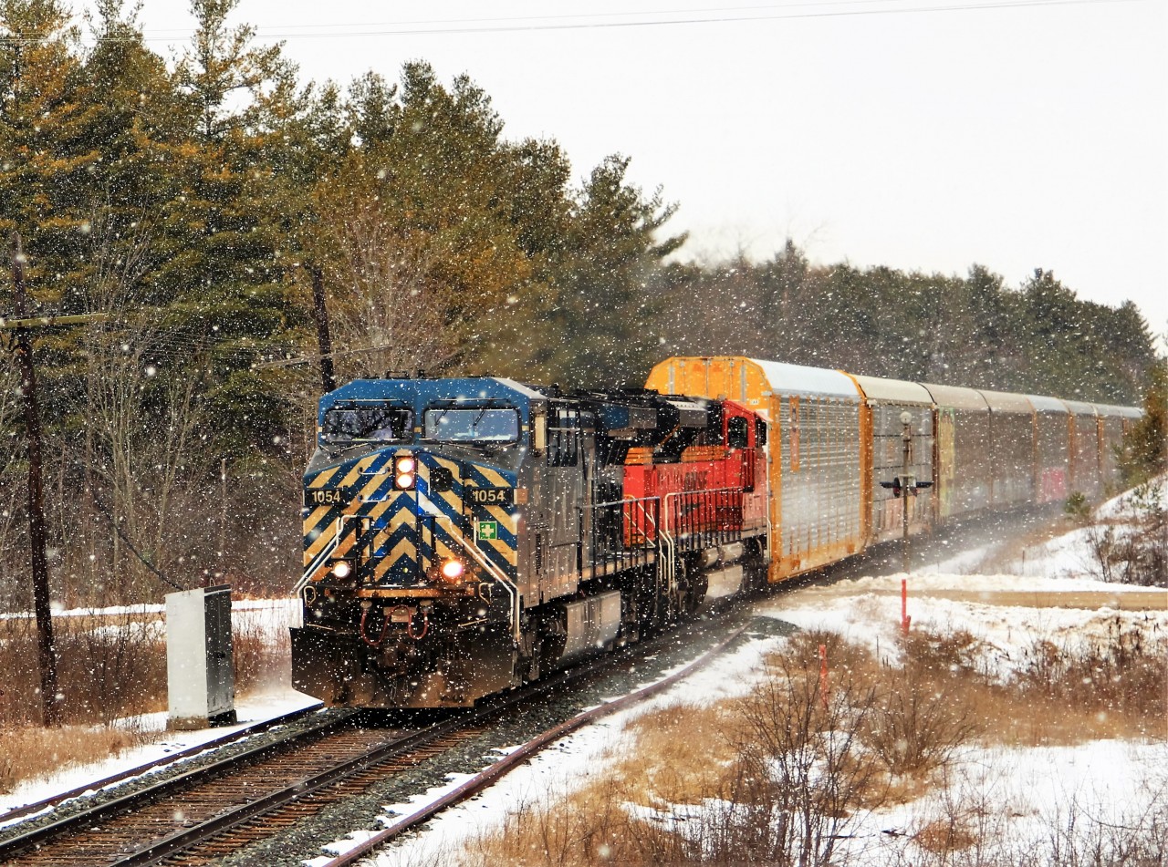 While standing here waiting for the daily CP 147 to get to my location, a sudden burst of snow flurries did its best to hinder my shot of CEFX 1054 leading BNSF 9082 up to SR 20 and MM 49.3 on the Galt sub.