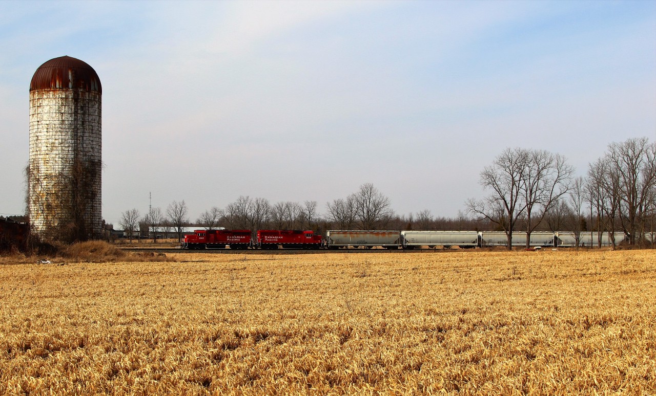 On first thought, I was thinking this would be a good location for a shot of the daily "pick up" train because the clouds were parting and the sun was trying to shine for me, and indeed it was. The bad part was there was 5 inches of snow here the day before. So when I strolled out in my Nikes to shoot CP 2265 and CP 2222, the 2 inches of mud I was walking through turned out to be quite the mess. Once I was half way, I figured I may as well get my shot because the damage was already done.