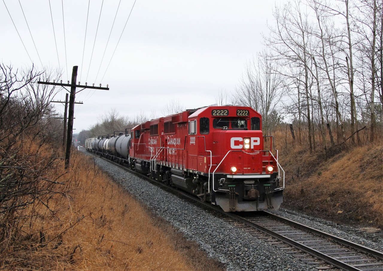 After doing a switch at Guelph Junction, the daily CP "pick up" is being led by CP 2222 along with CP 2265 westbound to the Orr's Lake siding. Only with the dull, overcast sky is this picture possible with the sun predominantly from the opposite side at this time of year.