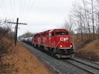 After doing a switch at Guelph Junction, the daily CP "pick up" is being led by CP 2222 along with CP 2265 westbound to the Orr's Lake siding. Only with the dull, overcast sky is this picture possible with the sun predominantly from the opposite side at this time of year.