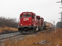 On a damp, drizzly afternoon, Ex-SOO, CP 6241 (GMD SD60) with CP 8720 ease their way up the Puslinch siding at MM45 on the Galt sub to wait for a north bound train to clear the Hamilton sub before they can proceed east then south down to Hamilton.
