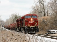 With the trees and weeds still holding on to the snow and ice from last night, daily runner CP 246 works its way down the Hamilton sub led by CP 8859 and CP 8804 up to the Flamboro detector and MM 71.2. 