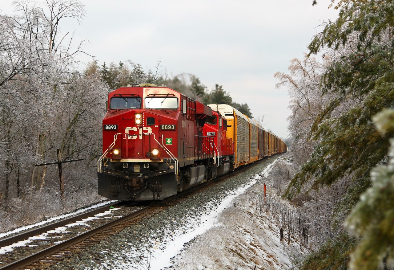 With yesterdays snow and ice still hanging on the trees, CP 147 is led by CP 8893 with former SOO, CP 6259 through Puslinch approaching the 20th side road and MM 49.3 on the Galt sub.
