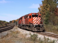 The Levack Turn is in the process of leaving CP's Cartier Sub and heading down the Levack Spur towards Coleman Mine. There it will exchange its empty string of gondolas for cars loaded with nickel ore. Then the train will proceed back to the concentrator at Clarabelle Mill in Sudbury.