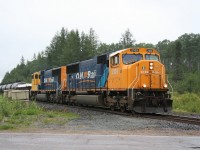 Ontario Northland northbound train 211 (Englehart to Rouyn-Noranda) finds a brief break in the rain at Jardine siding near Dane, Ontario.