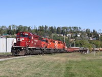 Three SD40-2 locomotives lead their train through downtown Nipigon.  I had been waiting all morning for an eastbound (there's a neat bridge shot just outside of town) that never materialized so this was, at the time, a consolation prize.  Nowadays, a train with power like this is something that I'd be chasing.