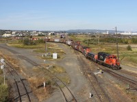 CN 7278 leads a cut of hoppers through the yard at Thunder Bay North prior to servicing one of the grain elevators.