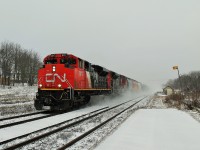 CN 331 dashing through the snow as it flies by the Woodstock VIA Rail station on a cold January afternoon. 