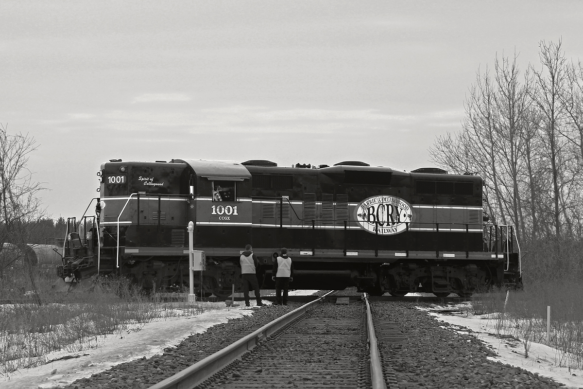 The Meaford Sub west of the CP MacTier Sub met its end on July 14th, 2011, with the same old swan song being sung like it had been several times over the past few decades. Since BCRY is owned by the city of Barrie though, the old class 1 move in which you rip up a line as soon as it is decommissioned was not undertaken. It paid off, as the collapse of the oil economy necessitated the storing of thousands of tankers across North America. The Penetang Spur in Colwell had already been crammed full with tankers, so BCRY decided to reactivate the Meaford Sub as far as 5th line at the east end of Angus for storage. BCRY 1001 would first do a test run to 5th line to confirm the track is in suitable condition. Here, it knifes the diamond for the first time in almost five years. The run to 5th line was successful, and it returned only to be snagged by CP 420, 118 and 113. Like most days, the lighting here was awful, but for a somewhat historic moment, I had no choice. The lighting did not improve even after it started raining, and I decided to leave before the tanker storage began. It's moments like this a drone would come in handy.

Unfortunately, the BCRY is a major debt burden, and costs the city of Barrie nearly $1 million a year. However, Barrie's poor sales marketing for the railroad surely has not helped. Nonetheless, city council is considering cutting the railroad entirely among rising costs. Unless the tanker storage fees add up, the train coming to pick up these tankers once the oil economy rebounds may be a CP local.