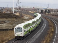 A full set new livery GO train with cab 307 leading west out of Oshawa station.