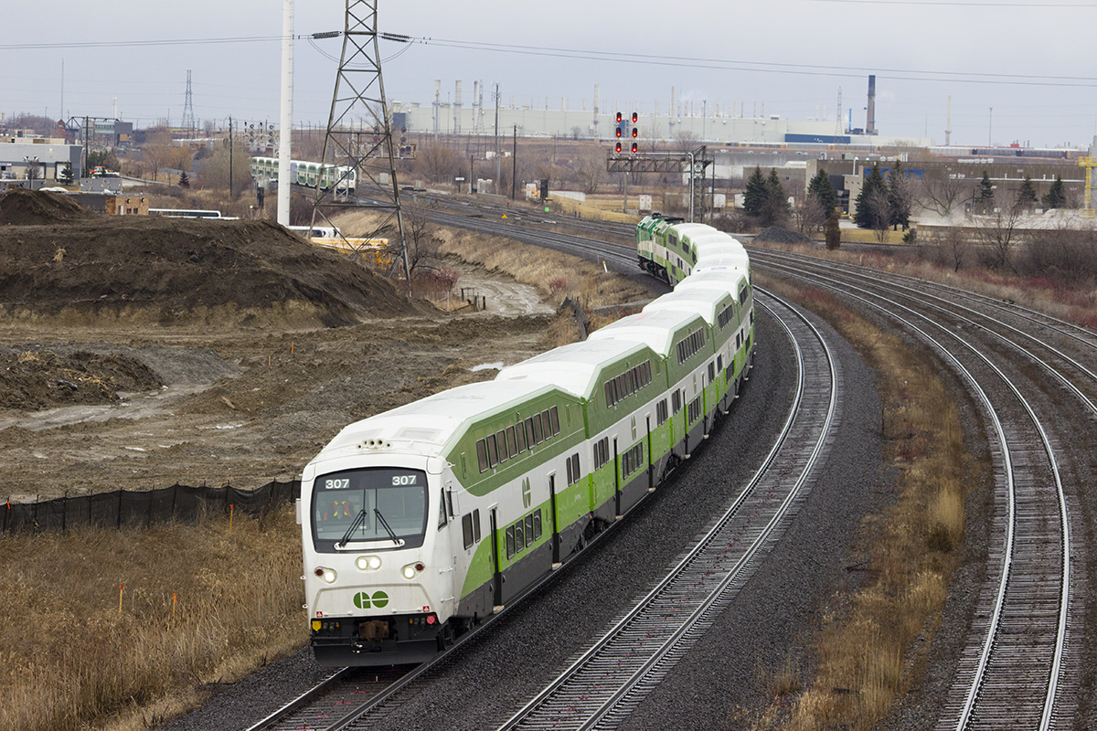 A full set new livery GO train with cab 307 leading west out of Oshawa station.