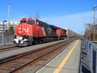 the CN-2318 a EF_644m with CN-8017 a SD-70m2 pulling a convoy of freights car coming from a stop at Joffre yard near Québec city  and dropping cars in Southwark yard Longueuil was on cn route 401 next stop Tachereau yard near Dorval MTL