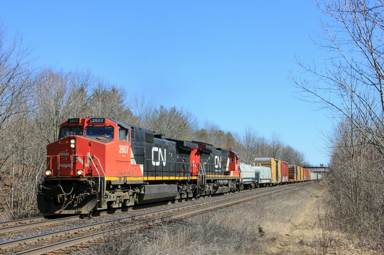 I spy foamers on the bridge! Oh, anyway. CN 331 departs Hamilton with a Dash 9, and a standard cab C40-8. Wrong leader though...