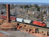 With a nod to <a href=http://www.railpictures.ca/author/ryan-gaynor target=_blank> Ryan Gaynor</a> who found the trails, here's my take on the Hamilton Century Brick angle. Unique because I had the chance to use a CP GP9 as my subject, two years after the last gp9 was taken off the roster - too bad 1650 wasn't a former TH&B unit.<br><br>The Century Brick factory is still a going concern one and a half centuries later, I chose to frame the smokestack, 'hive' and finished product into the shot rather than the entire facility.<br><br>Funny thing is the only reason I ever really ventured into this part of Hamilton as a teen was to visit Girlfriends. Now I visit because of trains... hmmmmmmmmmmmmmmmmmmmmmm. <br><br><b>ALSO - On the subject of sold CP GP9's -  OSR has also bought one: </b> I was informed by OSR Staff that CP 1594 was purchased by the railway. Have an eye..