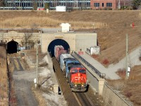 In response to Bill Thomson's <a href=http://www.railpictures.ca/?attachment_id=24038 target=_blank>recent (1)</a> <a href=http://www.railpictures.ca/?attachment_id=23890 target=_blank>photos (2)</a> from Sarnia I respectfully submit this scene - of the <b>Paul. M. Tellier</b> tunnel from last weekend - a name known to railroaders.. and us... but not to many locals as this sign was only added in the last few years. For those new to Sarnia there is a nice pedestrian bridge you can access to photograph the tunnel from Tecumseh St (and NOT from Vidal St!) away from all the road traffic. The only annoying thing added in recent years... the cameras, and the constant whine of fake bird noises to scare animals and birds from entering either tunnel and setting off alarms. (The poor residential houses on Tecumseh St - I don't know how they put up with the noise, it's out of this world and not 'normal' bird noises obviously to scare animals!). I'd love to submit this to the Time Machine but I didn't quite frame it right - my shot is compressed due to telephoto and cropping and Bills seems to be more wide, perhaps on the 50mm side so it does not line up quite right for me. I'll do this again and get it right next time :)