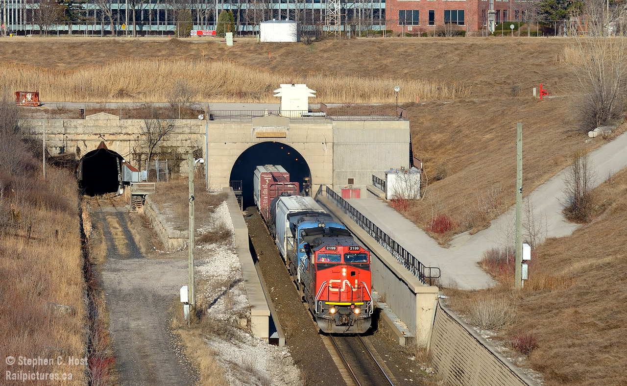 In response to Bill Thomson's recent (1) photos (2) from Sarnia I respectfully submit this scene - of the Paul. M. Tellier tunnel from last weekend - a name known to railroaders.. and us... but not to many locals as this sign was only added in the last few years. For those new to Sarnia there is a nice pedestrian bridge you can access to photograph the tunnel from Tecumseh St (and NOT from Vidal St!) away from all the road traffic. The only annoying thing added in recent years... the cameras, and the constant whine of fake bird noises to scare animals and birds from entering either tunnel and setting off alarms. (The poor residential houses on Tecumseh St - I don't know how they put up with the noise, it's out of this world and not 'normal' bird noises obviously to scare animals!). I'd love to submit this to the Time Machine but I didn't quite frame it right - my shot is compressed due to telephoto and cropping and Bills seems to be more wide, perhaps on the 50mm side so it does not line up quite right for me. I'll do this again and get it right next time :)