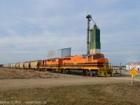 We're east of Clinton at an elevator owned by Cargill, extra 581 is giving 'er eastbound at track speed with salt loads. Due to a problem at the mine, salt is or was being trucked from the mine to seaforth for loading, and Compass Minerals paid for a rare extra switch on a Saturday. The crew ran straight to Seaforth from Stratford, lifted loads, set off empties, and ran to Clinton to wye the entire train before heading back to Stratford.