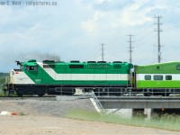 <b>Juxtaposition</b> If you saw this photo 6 years ago you'd probably go WTF. You may still go WTF, but for different reasons. Where's the GO logo? What's that new scheme on the coach? Is this a new commuter operation? Welcome to the new GO Transit! Only time will tell if the F59's get the 'new scheme' some day, for now this is the closest you can get to a juxtaposition of the new and old..<br><br>
Since this photo was taken. a nice fence has gone up along King Rd. Kiss yet another photo spot good bye.

