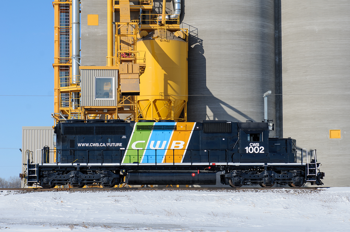 Canadian Wheat Board's SD40-2 #1002 sits quiet outside of the brand new elevator at the brand new super terminal just west of Bloom on CN's Rivers Sub.