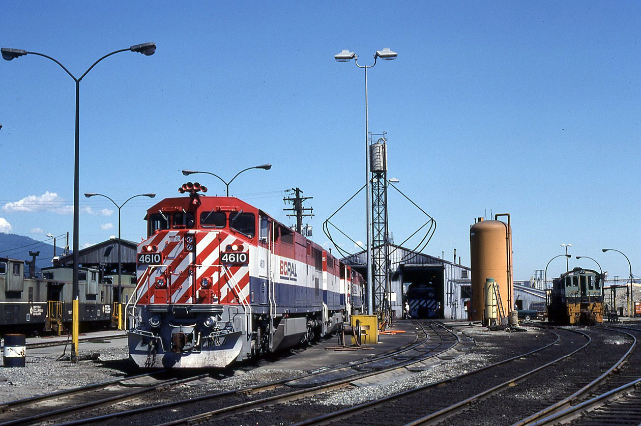 A trio of Dash 8-40,s with 4610 still sporting its horn up front have been serviced and are ready for the next north bound freight. S13 #502 can be seen to the right and an RDC is inside the shop under going scheduled maintenance. Fred  still in its youth , the BCR cabooses on the left are still in service.