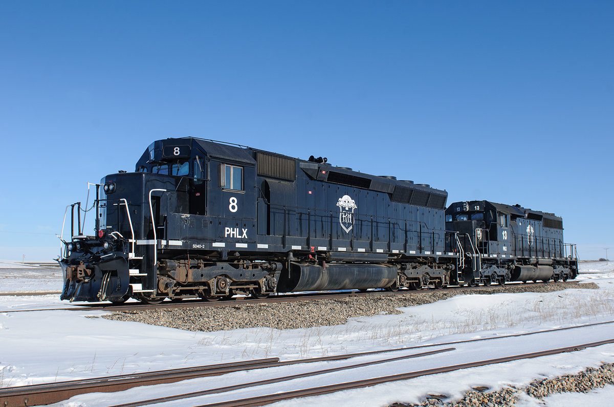 PHLX SD40-2s 8 (in an SD45 body) and 13 rest outside of the large elevator at Oban, SK, 8.6 miles west of Biggar on CN's busy Wainwright Sub. #8 is originally an SP unit and #13 originally a CN unit, which would've passed by this location many many times.