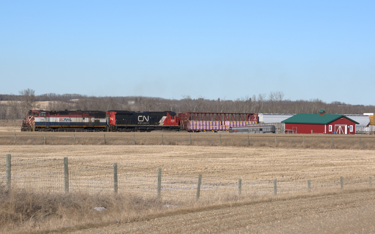 Heading into the siding for a meet, BCR 4604 glides past the local ranch.