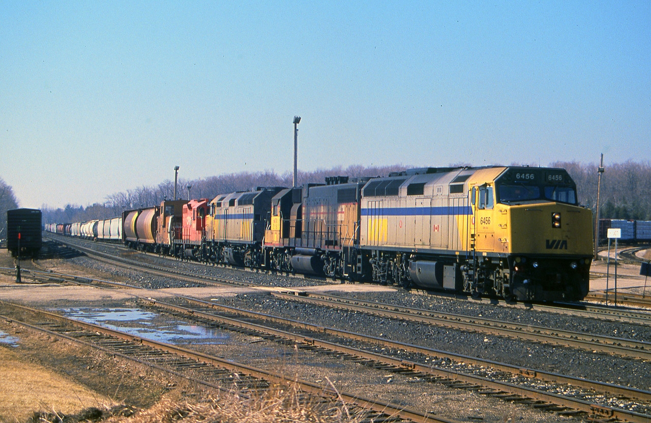 Back in the mid-90s when CP was leasing everything they could get their hands on, sometimes even us "seasoned" guys could not believe what we were seeing. This oddity made up the Guelph Jct Turn, which used to come from The Big Smoke,interchange at the Junction and return. VIA 6456, HATX 216, VIA 6455, CP 8241 brought in a long train, set off most it's train east of the junction and then backed around the wye, and as you see it in this image, it is nosed up to the "Guelph Jct" namesign, and is going to drop off the rest of its' train; then running back east with only the lead three units. Pity the HATX 216 (x-UP 2110) is so filthy, but ya take what ya can get.