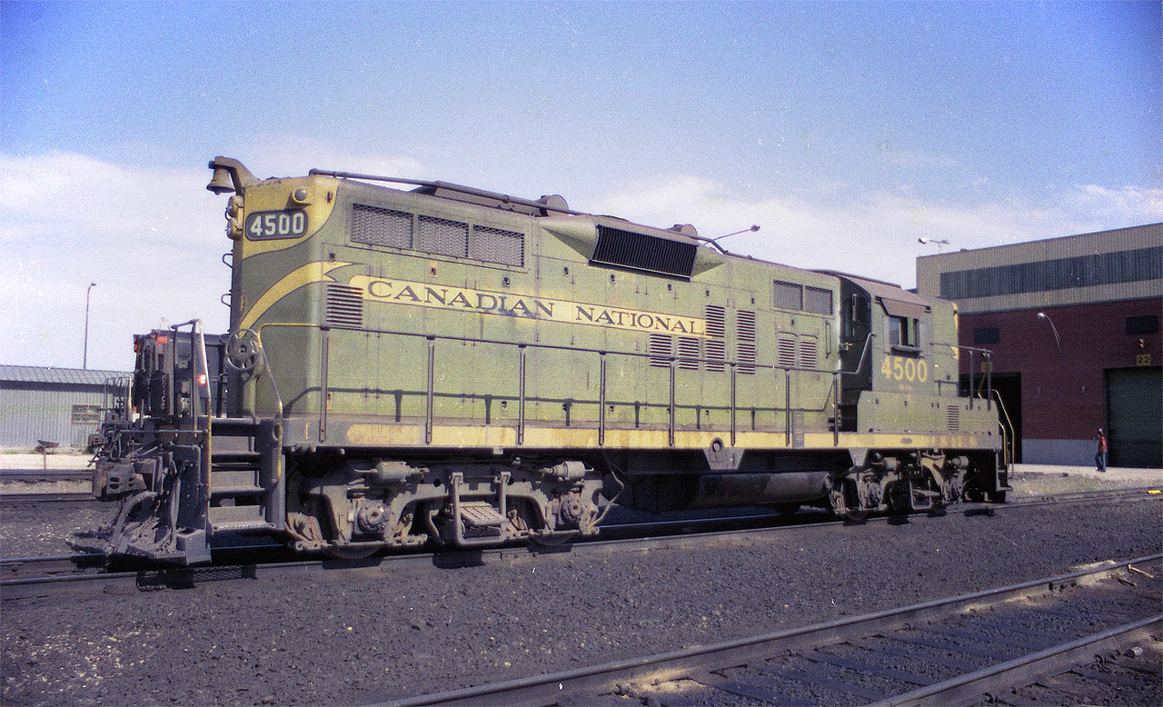 As I have mentioned before, I am not much for shooting roster photos; but seeing this was far too good to pass up. By 1976 there were very few green/yellow CN paint locos around; having the scheme being phased out many years before, and this one is sitting clear in the open under perfect lighting. A gift!!!  Even though it is coming up to 40 years since I shot this image, it remains one of my all-time favourite catches. Digital processing of a miserable old Woolco negative made this image presentable. Shot with a tempermental mechanical piece of junk called a Miranda camera (35MM) on a trip westward, it was one of the few images I managed to save from a terribly disappointing trip, photography-wise.................CN 4500 became 7260, GP9RM, under a rebuild program, but was retired in 2013.