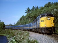 This is my wife's shot. I was standing nearby to take my own photo, but I forgot to cock the shutter release (wasn't my first time nor the last with a manual advance camera). This is a rather nice location along Shubenacadie Grand Lake near Laurie Provincial Park.
Incidentally, the train is eastbound, nearing the end of its journey from Montreal.