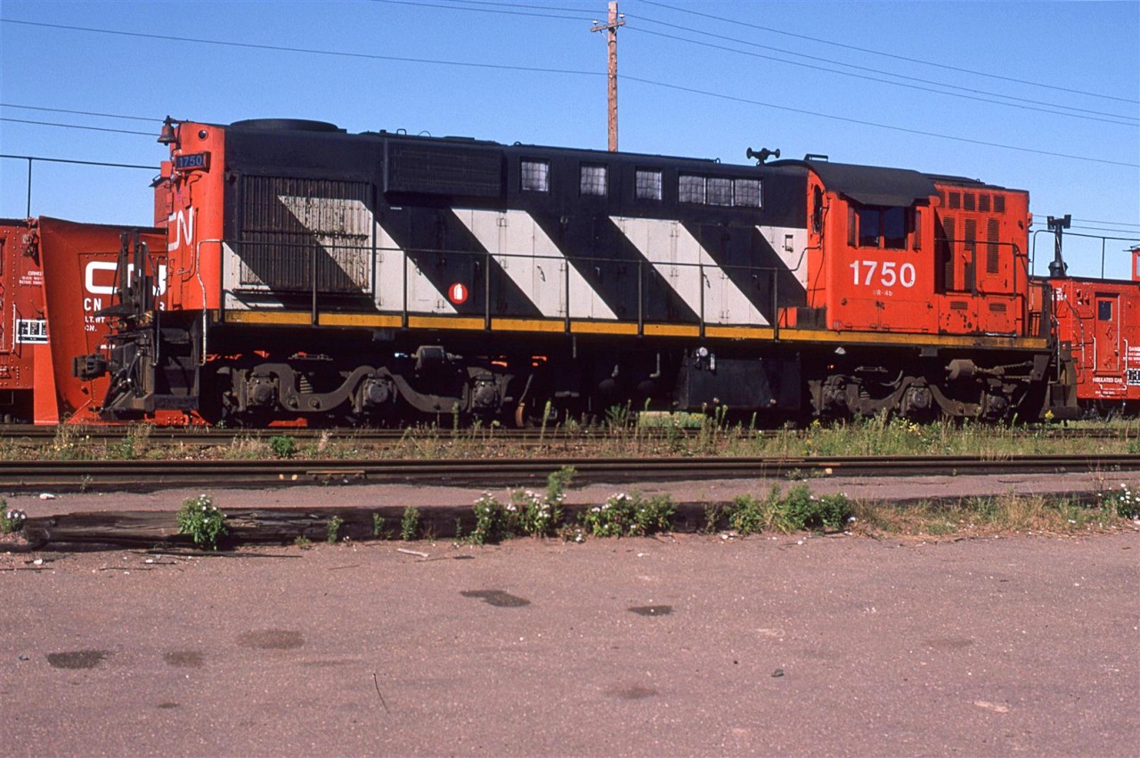 Not really exciting - a re-trucked RS-18 for light rail use. The interesting thing, and this is not too evident, is that it was shot in PEI. In the background are a couple of snow plows.