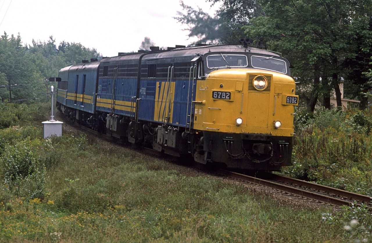 This may be my last shot of an active FPA-4. My vacation in Nova Scotia was over and I would be moving from Calgary to Edmonton to attend the University of Alberta. My brother would continue to photograph the old girls, and document the transition over to the F-40PH's.
This is the westbound "Atlantic" heading through Windsor Junction on a gloomy overcast day.