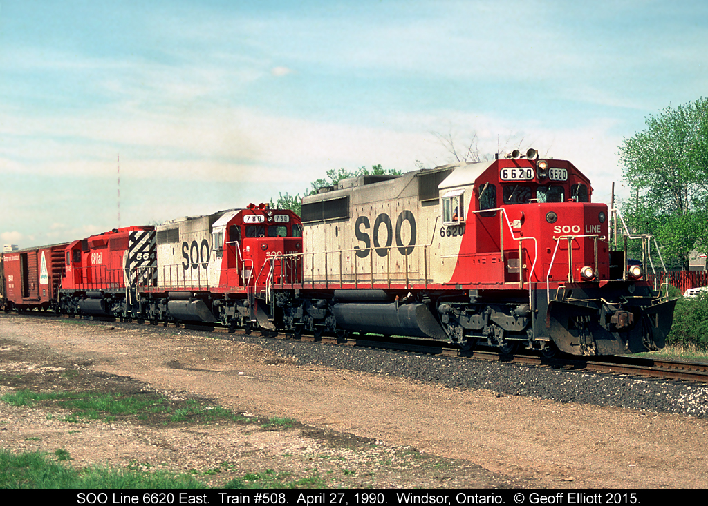 SOO Line 6620 and 780 lead a CP 1/2 sister into Canada after traversing the Windsor/Detroit railway tunnel on CN's CASO Subdivision with CP train #508 on April 27, 1990.  The train is rolling over the 'new' back track at Windsor South and is technically now on CP's Windsor Subdivision.