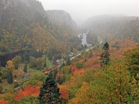 One of the iconic shots of the Agawa Canyon Tour Train has always been the shot looking down on the park from the Lookout. Only problem (for the day-trippers anyway) was by the time you scampered up the 372 steps to get there they'd already uncoupled the power from the front end of the train and run it around to the back end in preparation for the return trip. We solved this problem by booking the <b>Canyon View</b> "Camp Car" for the last week of operations several years running (until the price encroaching the $2K zone combined with the horrifically lumpy mattresses and the constant septic system backups made it no longer overly attractive to us). We'd climb up there almost every day to wait for the train and after it arrived, fight the onslaught of stair-climbers to get back down to the bottom. There are always those tour passengers who were so in awe of their own athletic prowess that they'd take great glee in running to the top ahead of everyone else, so we'd time it just right that we'd meet them about 20 steps down just to see the looks on their faces when confronted with a couple of (upper) middle-aged folk loaded with a ton of camera gear coming back down and telling them "only a few steps more and you're in for a beautiful view"! After we'd got back down and had lunch, and all the tour passengers had been herded back on board we'd shoot the train as it was departing, another opportunity not available to those who didn't actually stay there.