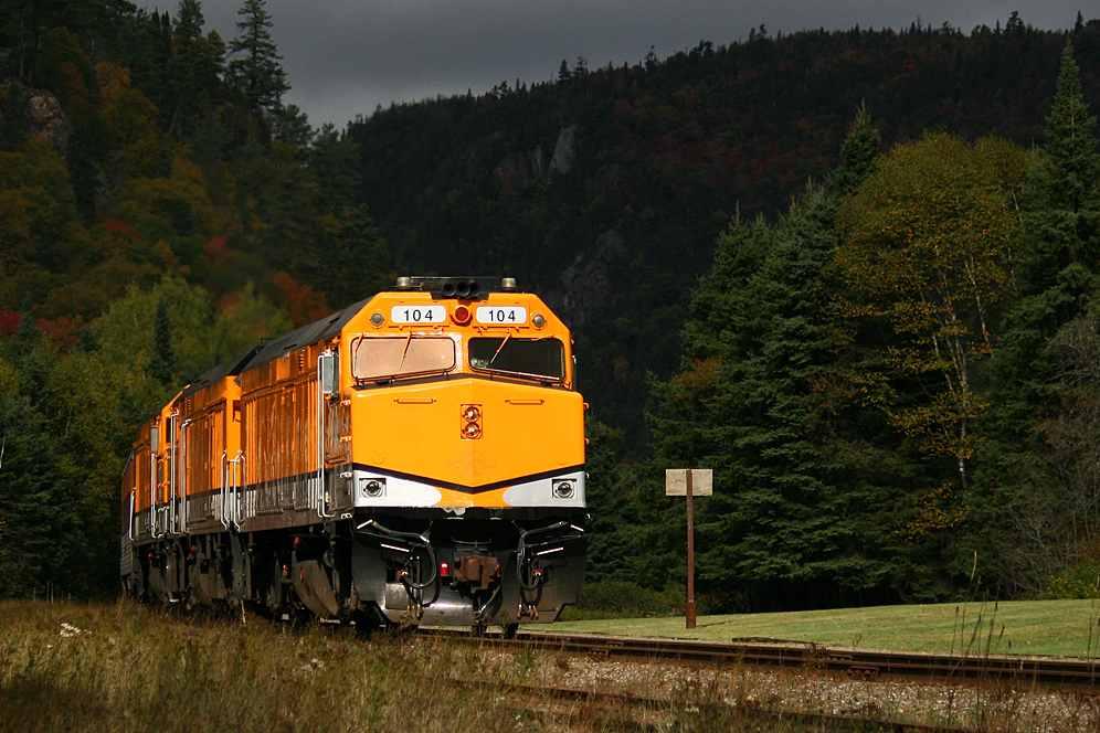 The Agawa Canyon Tour Train is loaded and heading south out of the park on its way back to Soo Ste. Marie. I believe this was the first or second season of operation after CN had acquired the former DRGW Ski Train equipment so it was all still painted in the retina-burning "bumble-bee scheme" as the park employees referred to it, but in this case it made for some perfect "storm light" as the train passed our vantage point. That entire week it rained most of the time and the appearance of the sun here was fleeting, but timed perfectly!