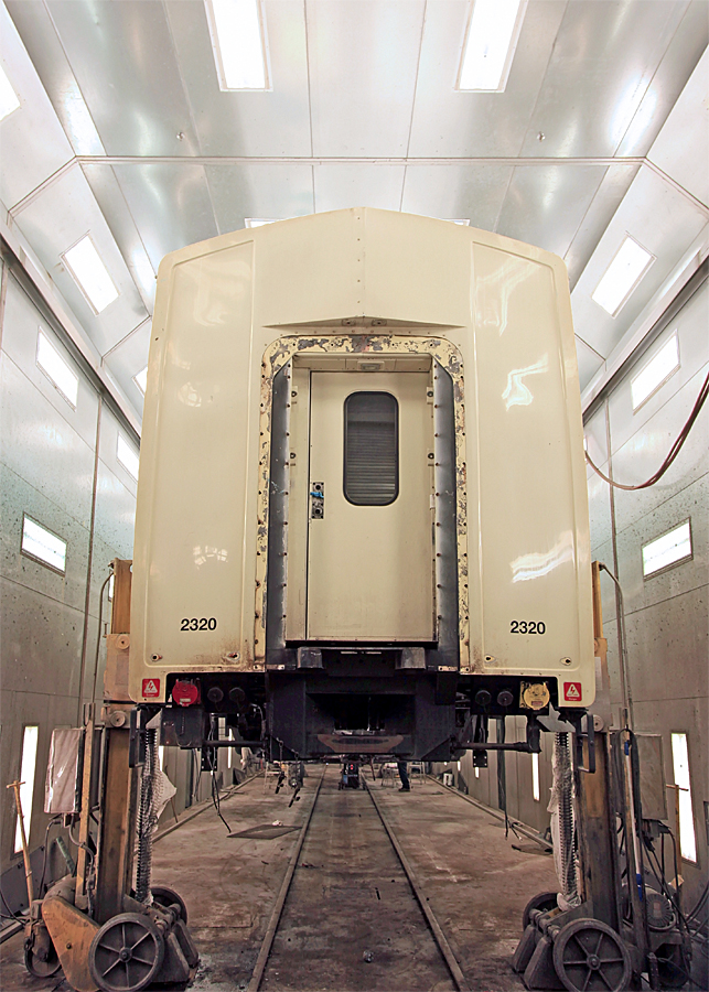 This is the Ontario Northland North Bay Shops "grunge booth", located next to the paint booth. In here car bodies are jacked up and the trucks rolled out of the way so that the cars can be thoroughly cleaned, stripped and prepped for painting. Car refurbishing is a big part of business at the North Bay Shops, and they have a reputation for sending out a product that is noticably superior to "factory fresh"!