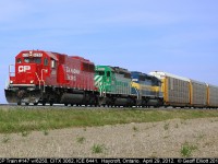 A colorful lashup on a nice day makes for some nice photos.  CP 6250 leads CITX 3062 and ICE 6441 on train #147 as they roll down the CP Windsor Subdivision through Haycroft, Ontario on April 29, 2012.
