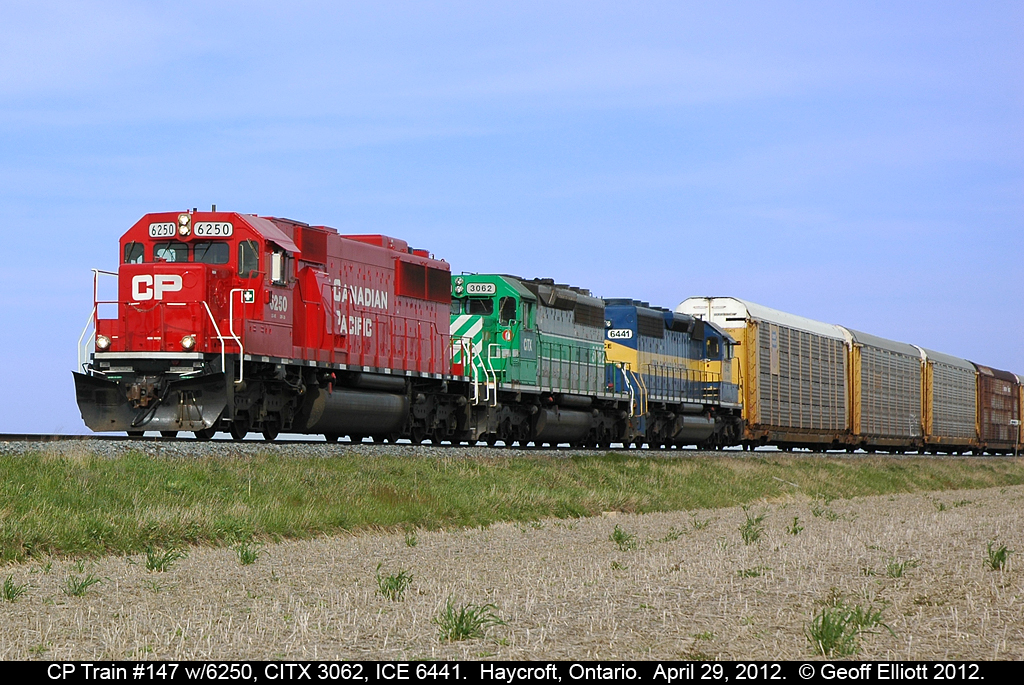 A colorful lashup on a nice day makes for some nice photos.  CP 6250 leads CITX 3062 and ICE 6441 on train #147 as they roll down the CP Windsor Subdivision through Haycroft, Ontario on April 29, 2012.