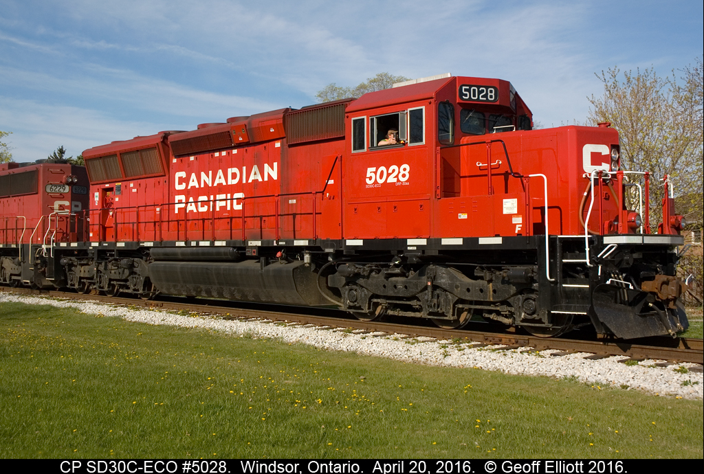 SD30C-ECO #5028 sits as train T28 (CSX Grain Train) on the Essex Terminal waiting on a signal from the RTC to proceed back to home rails after delivering an 80 empty CSX grain train to the ETR for forwarding to ADM in Ojibway.