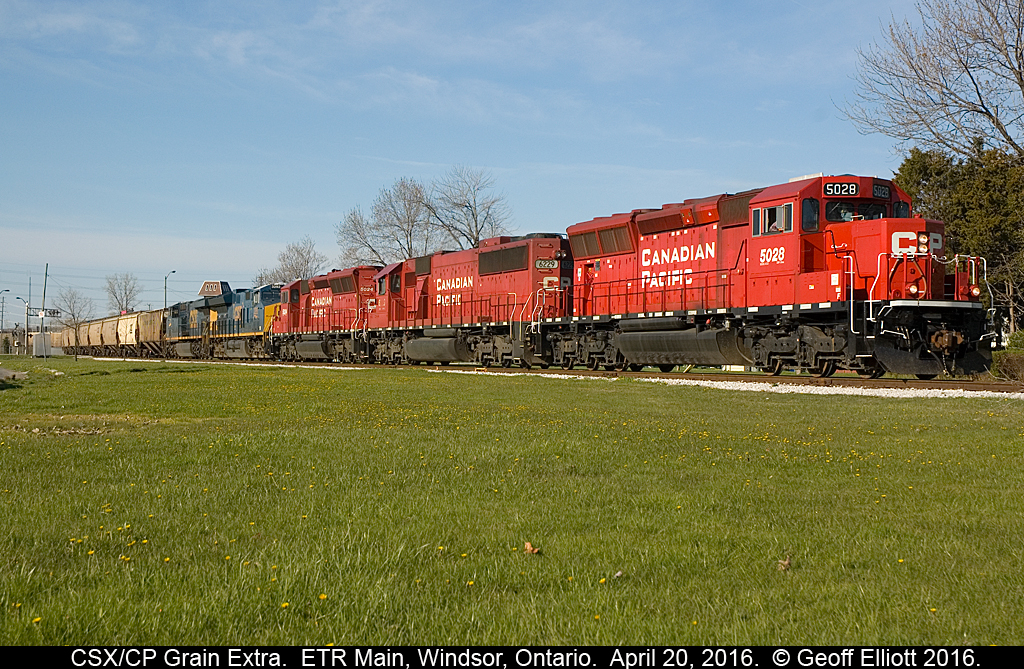 Big move on the Essex Terminal today as another CSX unit grain train is delivered to the ETR for forwarding to ADM out in Ojibway.  Train arrived early this morning with CSX 3292 and 772 as power.  Train was tied down @ Dougal Ave. until T28's power, CP 5028, 6229, and 5024 were added to the head end.  From there T28 pulled the 80 car empty train east onto the ETR and down past Howard Ave to clear the crossovers at Lakeshore.  ETR GP9 #108 would have the honors of taking the train to ADM and it waited for 5024 to shove back to where it was waiting.  Once ETR 108 was coupled on and had air on the train, T28/CSX power was cut away and ETR 108 headed for Ojibway while the CP/CSX consist headed back to Windsor Yard.