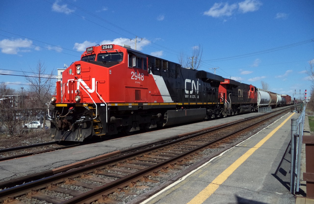 CN-2948 fresh leading loco with CN 2826 a EF 644 n pulling over 7,000 feets of freights cars going to Tashereau yard Montréal near Dorval