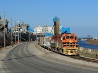 GEXR 2303 and RLK 4095 lead a cut of 10 salt-filled hoppers as they are about the tackle the grade leading to the yard in Goderich.