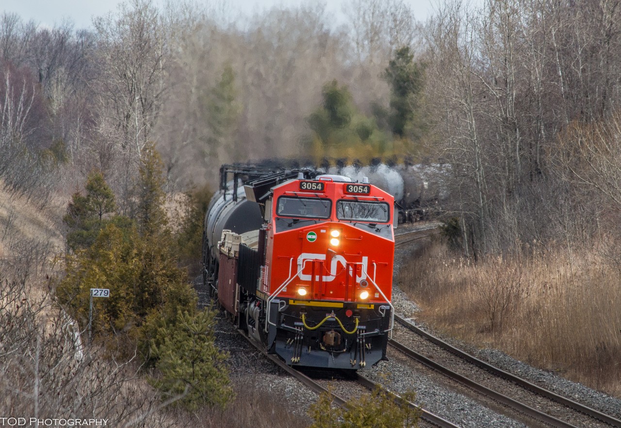 CN 305 heads West on approach to Newtonville, with a brand new CN Tier 4 on point, and another working mid-train.

CN 3054 & CN 3055