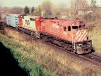 CP 4233 leads one of a kind SOO SD40-2B on a westbound at Bowmanville May 6, 1995. The 6450 was originally BN SD40  #6402 and was rebuilt into the 'B' unit after a wreck. The dynamic brake grids have an unusual end placement. It was scrapped in 2004.