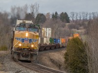 A late morning 142 slithers through the curves of Newtonville with a pair of UP Yellowbirds providing the power.

UP 5537 & UP 5432